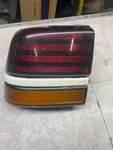 1988-1991 Pontiac Sunbird Left Driver Tail Light 2 Door Quarter Panel Mounted. Fixed Price $35.00.