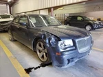 Driver Left Headlight Xenon Hid Fits 05-07 300 959988. Fixed Price $340.00.