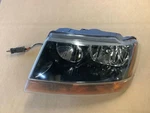 Driver Headlight Smoke Tint Dark Background Fits 99-02 Grand Cherokee 302337. Fixed Price $83.74.