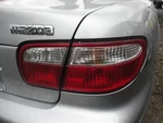 Passenger Right Tail Light Lid Mounted Fits 99-00 Mazda Millenia 3876041. Fixed Price $110.70.