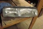 Driver Left Headlight Door Fits 93-96 Regal 41560. Fixed Price $60.00.