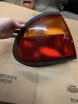 Driver Left Tail Light Outer Fits 96-98 Mazda Protege 702112. Fixed Price $65.00.