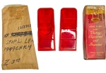 New Old Stock Stop Lamp Red Lenses For 1949 Chrysler Models #1253307 & 1253308. Fixed Price $300.00.