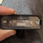 New Oem Vw Volkswagen License Plate Light Beetle Golf Cabrio 1J6943021B. Fixed Price $40.00.
