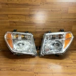 Pair Left Right Headlight Assembly Fits 2005-2008 Frontier Pathfinder Clear. Fixed Price $50.00.