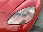 Driver Headlight Red Exterior Color Opt 74U Fits 05-09 Corvette 5214069. Fixed Price $348.50.