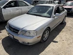 Driver Left Headlight Outer Low Beam Fits 05-06 Magentis 1494851. Fixed Price $50.00.