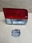 Driver Left Tail Light Coupe Lid Mounted Fits 96-00. Fixed Price $49.88.