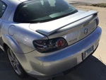 Driver Tail Light Silver With Red Lens Surround Fits 04-08 Mazda RX8 535327. Fixed Price $129.89.
