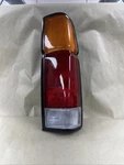 Fits 1986-1997 Nissan Pickup Passenger Right Side Rear Brake Tail Light Lamp. Fixed Price $50.00.