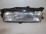 Mazda 626 1988-1992 Lh Drivers Side Headlight Assembly With Mounting Bracket Oem. Fixed Price $61.10.