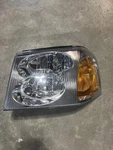 Driver Left Headlight Fits 02-09 Envoy / Denali. Fixed Price $85.00.