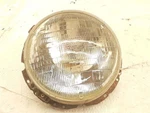 Headlight Outer Fits 85-93 Cabriolet Convertible 1583775. Fixed Price $91.34.