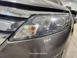 Driver Left Headlight Bi-functional Halogen Fits 10-12 Fusion 1347575. Fixed Price $60.00.