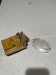 1957 Chevy Nos Delco Guide Clear Glass Back-up Lamp Lens 5948323. Fixed Price $40.00.