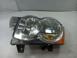Driver Left Headlight From 2010 Jeep Grand Cherokee 11944891. Fixed Price $121.94.