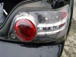 Passenger Tail Light Silver With Red Lens Surround Fits 04-08 Mazda RX8 2644939. Fixed Price $107.00.