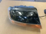 Passenger Headlight Smoke Tint Dark Background Fits 99-02 Grand Cherokee 302338. Fixed Price $85.45.