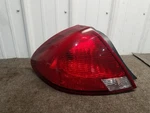 2000-03 Ford Taurus Drivers Left Tail Light Quarter Mount (w/o Border). Fixed Price $24.50.