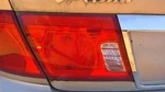 Driver Left Tail Light Lid Mounted Fits 03-06 Magentis 244594. Fixed Price $83.99.