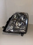 Driver Left Headlight Halogen Fits 05-11 Sts 2131540. Fixed Price $110.00.