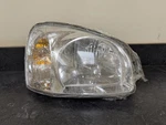 Passenger Right Headlight Thru 07/13/03 Fits 01-04 Santa Fe 873867. Fixed Price $83.00.