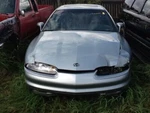 Tail Light Lid Mounted Gold Trim Opt BA5 Fits 97-99 Aurora 60399. Fixed Price $75.00.
