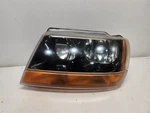 1999-01 Jeep Grand Cherokee Drivers Left Headlight Dark Background *cloudy*. Fixed Price $62.29.
